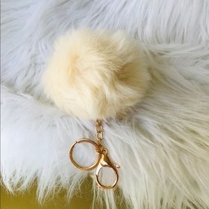 Off white faux furry Pom Pom keychain.